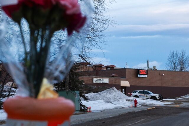 Flowers are placed near Tumbler Ridge Secondary school two days after the rural community