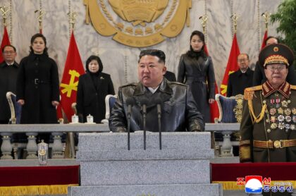 North Korean leader Kim Jong Un speaking at a military parade marking a rare congress of t