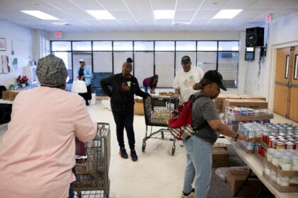 Residents turn up early at a food distribution point in Hyattsville, Maryland, to sign up