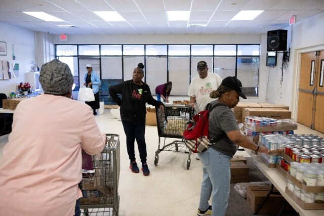 Residents turn up early at a food distribution point in Hyattsville, Maryland, to sign up