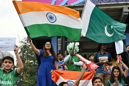 Rival fans wave the flags of India and Pakistan from the stands at the 2026 T20 World Cup