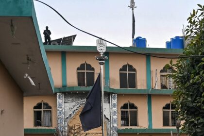 A security personnel stands guard at a mosque in Islamabad following a suicide blast that