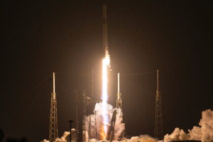 A SpaceX Falcon 9 rocket with the company's Dragon spacecraft on top launches from Ca