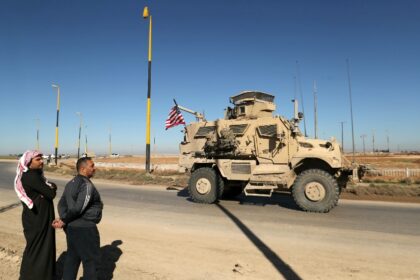 A US military vehicle in northeastern Syria driving towards the Iraqi border