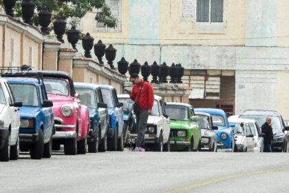 Vehicles wait in line to refuel at a gas station in Havana, with Cuba's communist gov