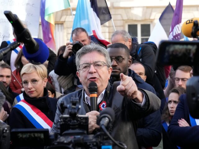Black lawmaker Carlos Martens Bilongo, behind center, and lawmaker Clementine Autain, left