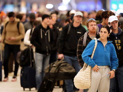 Title: Winter Blasts Weather Image ID: 25007057822897 Article: Hundreds of passengers wait
