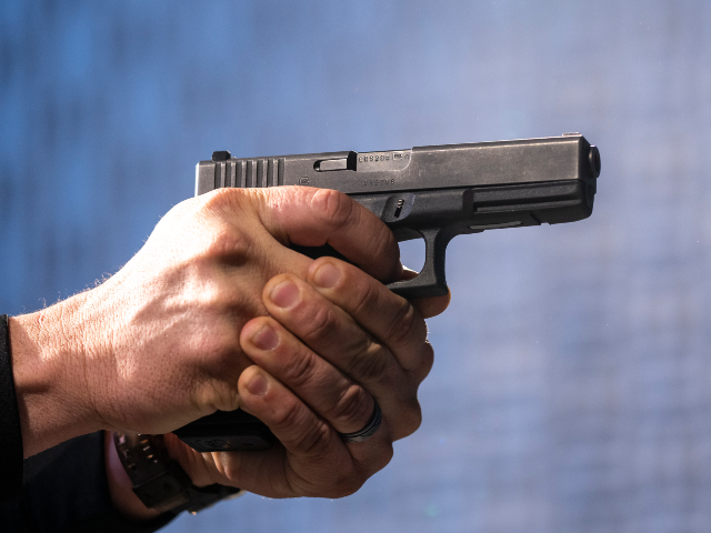 FILE - A semi-automatic Glock pistol is fired at the Bureau of Alcohol, Tobacco, Firearms,
