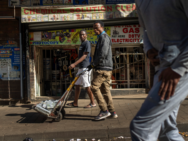 AP25144456539501 Residents watch the annual Hillbrow street parade organized by the Windybrow Arts Centre a