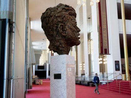 A bronze sculpture of President John F. Kennedy is displayed in the John F. Kennedy Memori