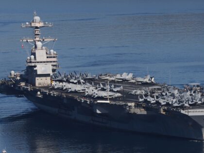 The USS Gerald R. Ford, the world's largest aircraft carrier, departs from Souda Naval Bas