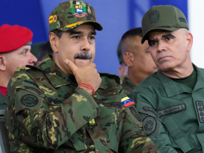 FILE - Venezuelan President Nicolas Maduro, left, and Defense Minister Vladimir Padrino Lo