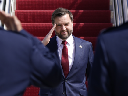 Vice President JD Vance salutes as he walks off Air Force Two, Wednesday, March 18, 2026 a