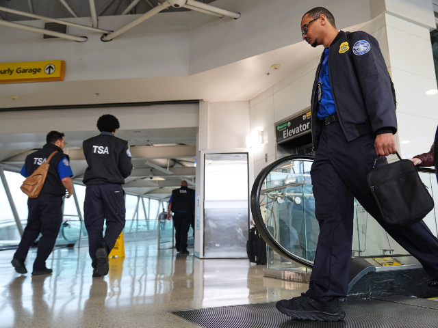 AP26082603019193 Transportation Security Administration agents leave the terminal following their shifts at