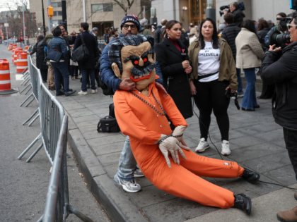 A demonstrator holds an effigy of former Venezuela President Nicolas Maduro outside Manhat
