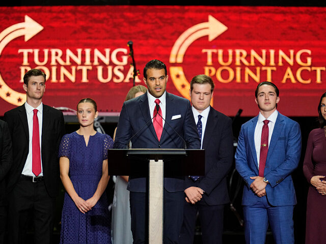 Andrew Kolvet, center, speaks at a memorial for conservative activist Charlie Kirk, Sunday