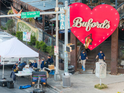Members of the FBI conduct an investigation near Buford's bar in downtown on March 01