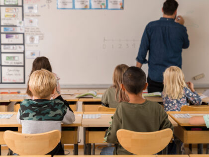 Classroom with kids and male teacher