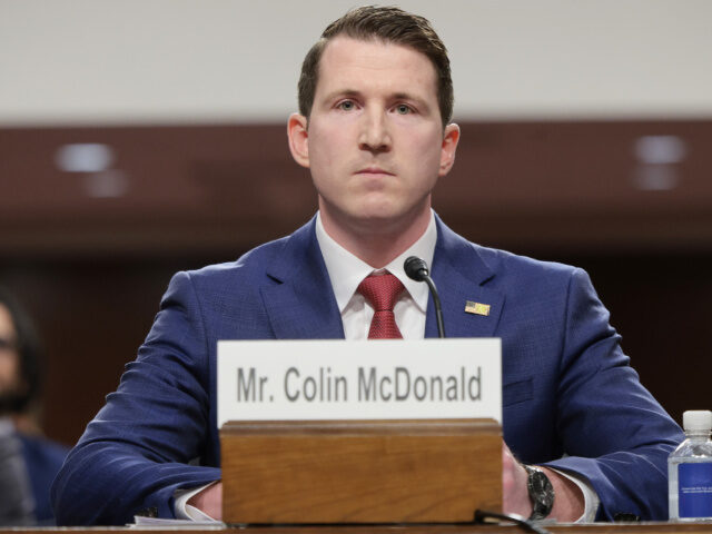 Colin McDonald listens during opening remarks at a Senate Judiciary Committee nomination h