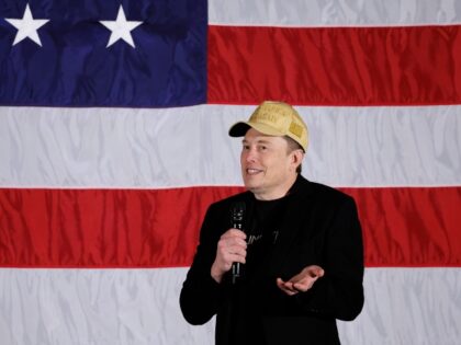 Elon Musk in front of American flag