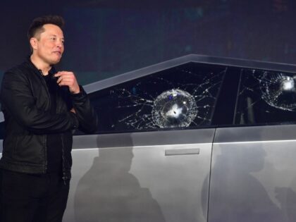 Elon Musk with his damaged Tesla Cybertruck