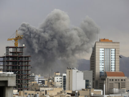 Smoke rises from the area after multiple powerful explosions occurred in several locations