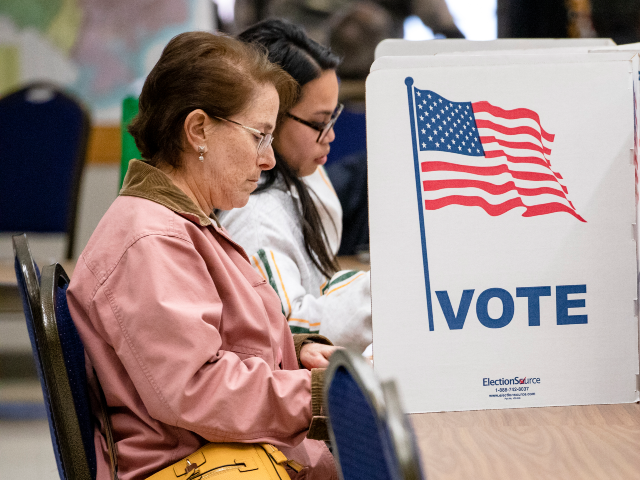 ANNANDALE, VA - MARCH 03: Women cast their votes in the Democratic presidential primary el