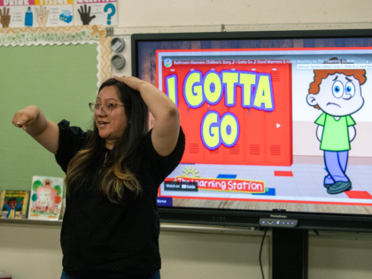 Chatsworth, CA - August 14: Teacher Miriam Bernal leads a restroom lesson during her trans