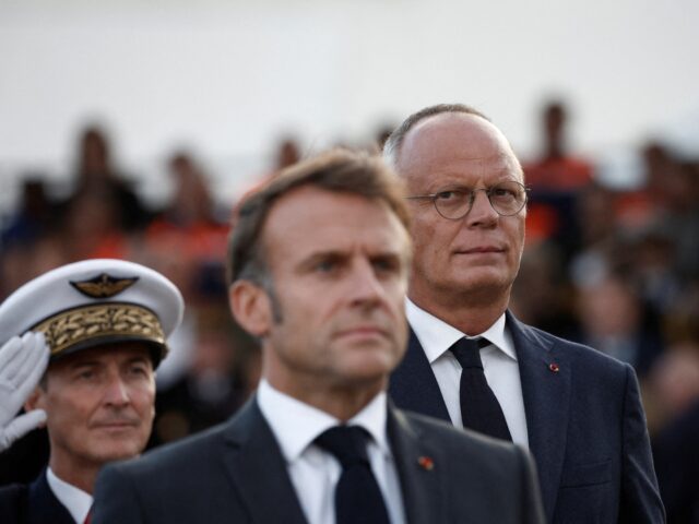Mayor of Le Havre Edouard Philippe (R) looks towards France's President Emmanuel Macron (C