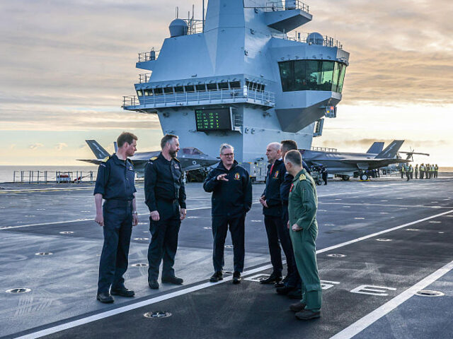 TOPSHOT - Britain's Prime Minister Keir Starmer (3L) and Britain's Defence Secre