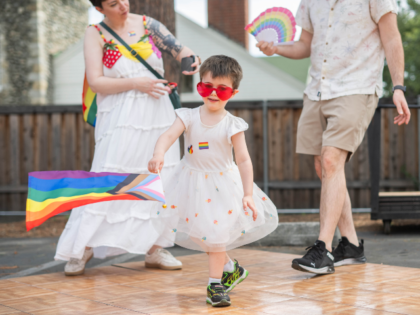 Altadena, CA - June 14:Shannon and Kris Bicknell and their 3-year-old child Arthur dance d