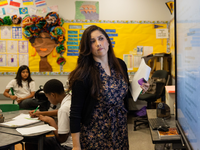 Inglewood, CA - October 22: 7th/8th grade social studies teacher Pilar Cuevas looks up at