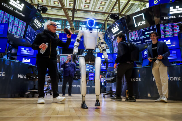 A Unitree Robotics G1 humanoid robot on the floor of the New York Stock Exchange (NYSE) in