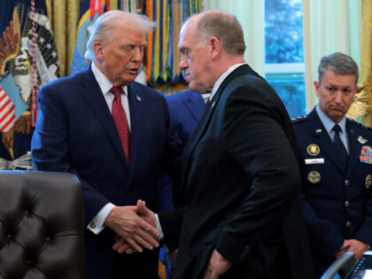 WASHINGTON, DC - DECEMBER 15: U.S. President Donald Trump shakes hands with White House Bo