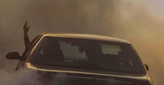 WATCH: Woman Allegedly Plows into Cop in Street Takeover, Goes Free on Low Bail - Breitbart by Lowell Cauffiel