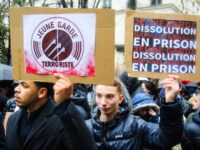 Young men holding placards Young terrorist guard Young guard dissolution Raphael Arnault i