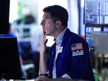 A trader works at his desk on the floor of the New York Stock Exchange (NYSE) at the openi