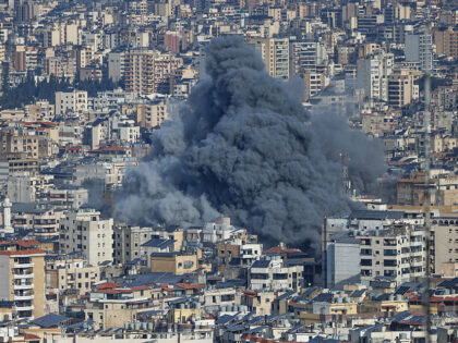 A plume of smoke rises from the site of an Israeli airstrike in the southern suburbs of Be