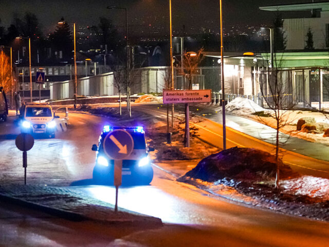 Police vehicles are parked outside the US embassy after a loud bang was reported during th