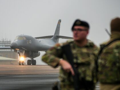 FAIRFORD, ENGLAND - MARCH 07: An armed airmen of the US Air Force guards the perimeter fen