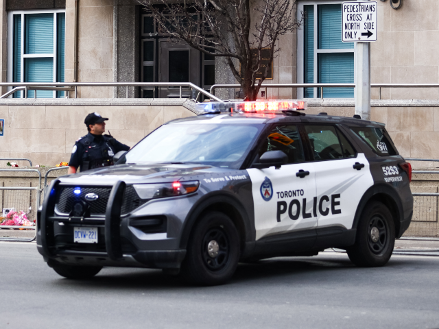 GettyImages-2265297643 Toronto Police officers work around the scene of a shooting at the US Consulate in Toronto