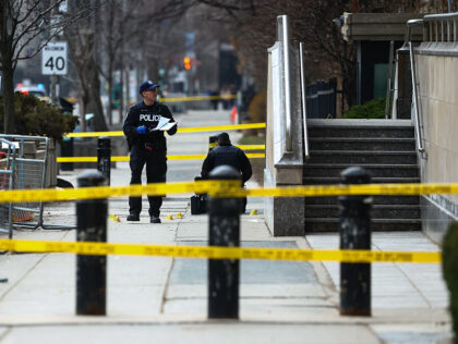 Toronto Police officers work around the scene of a shooting at the US Consulate in Toronto