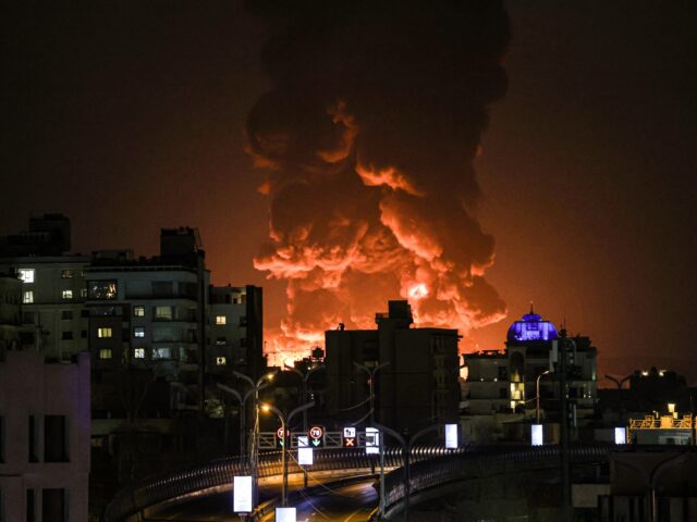 TEHRAN, IRAN - MARCH 07: A large plume of smoke rises over Tehran after explosions were re