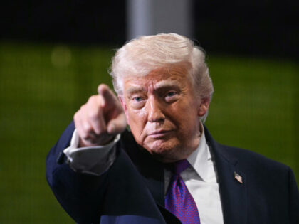 TOPSHOT - US President Donald Trump points as he speaks at Verst Logistics in Hebron, Kent