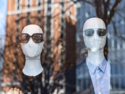 Sunglasses on mannequins in a window display at a store in Washington, DC, US, on Wednesda