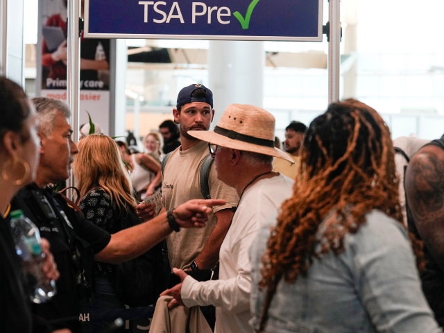 HOUSTON, TEXAS - MARCH 8: Airline passengers wait in long lines to get through the TSA sec
