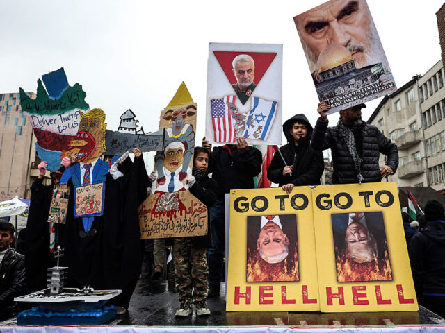 Iranians hold up posters as they take part in the Al-Quds (Jerusalem) Day rally, a commemo