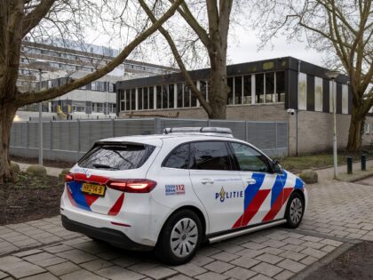 A photograph taken on March 14, 2026 shows a police car parked outside a Jewish school, in