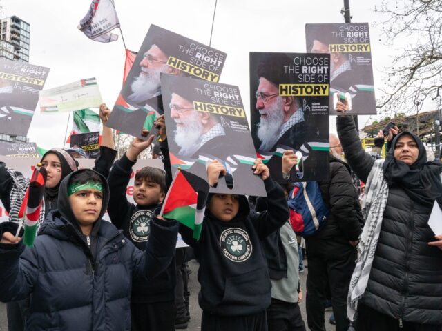 LONDON, ENGLAND - MARCH 15: A group of children hold placards saying Choose the Right Side