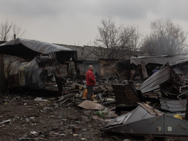 A man stands at the site of a recent Russian air attack in Zaporizhzhia on March 18, 2026,